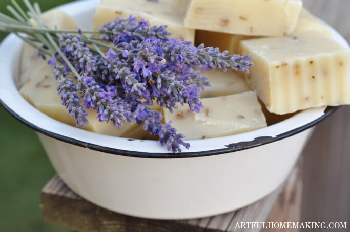 white enamelware bowl with fresh lavender and bars of homemade lavender soap