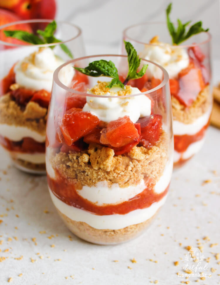 peach parfait with cream topped with mint