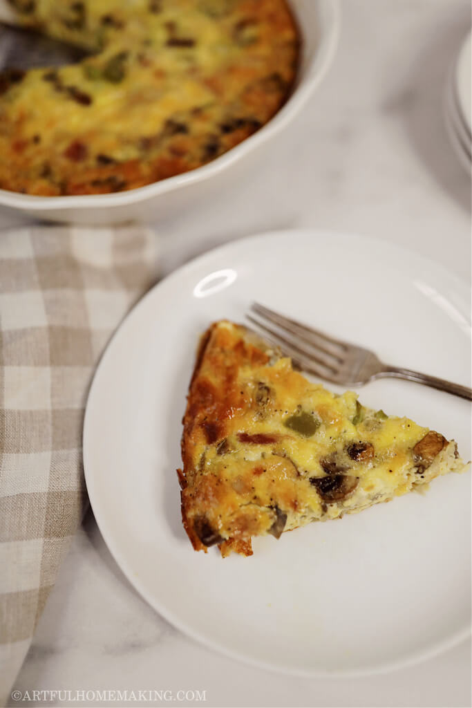a dish of crustless quiche on a white plate with a fork on the plate