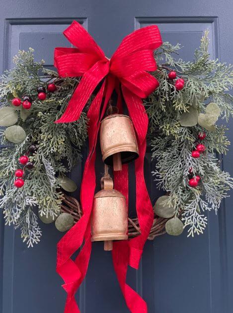 red ribbon christmas wreath with bells