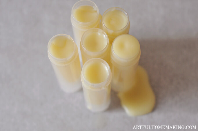 tubes filled with melted coconut oil, cocoa butter, beeswax, and essential oil