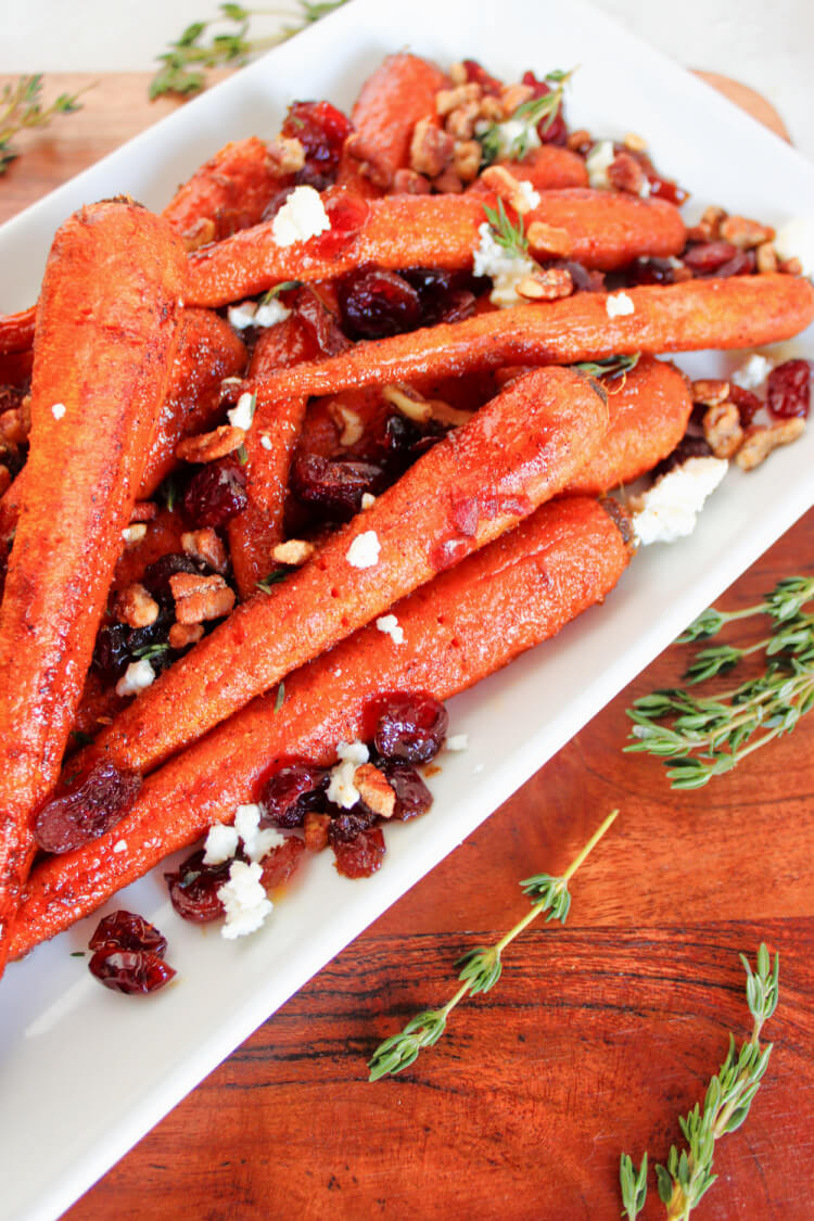 white rectangular platter with roasted carrots