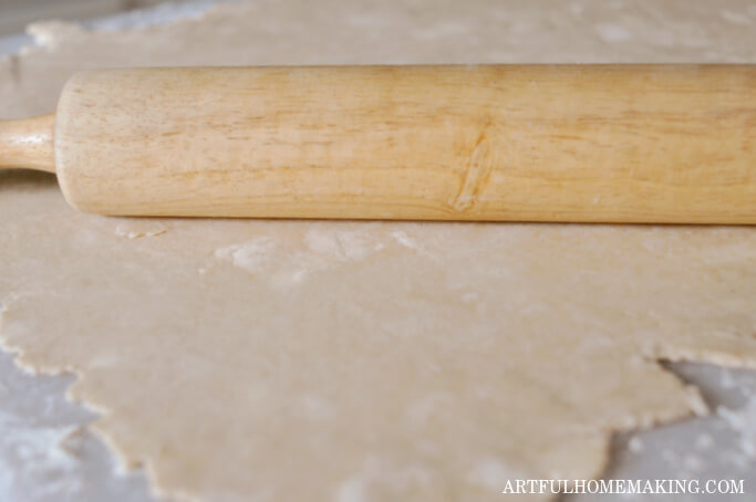 rolling out pie crust with a rolling pin