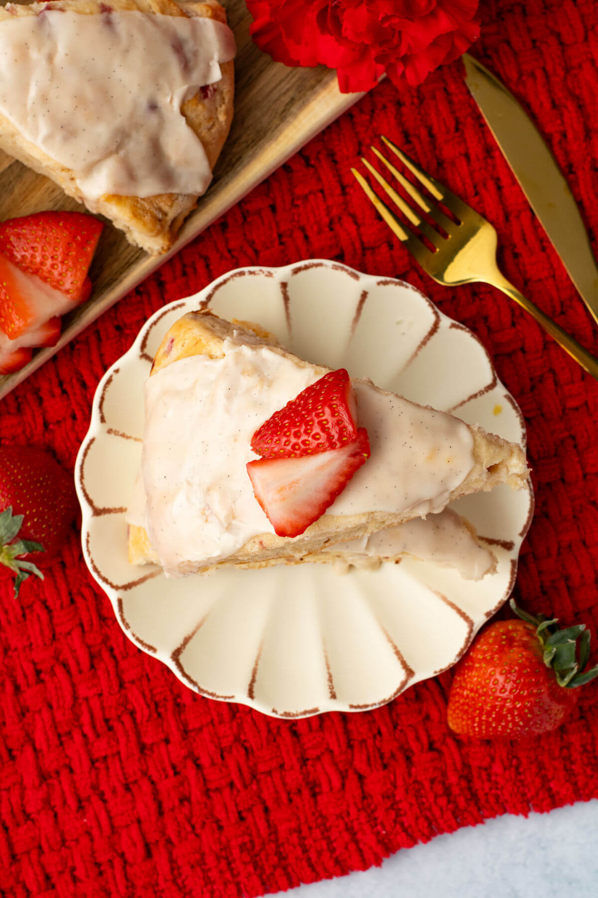 a slice of strawberry scones on a decorative plate