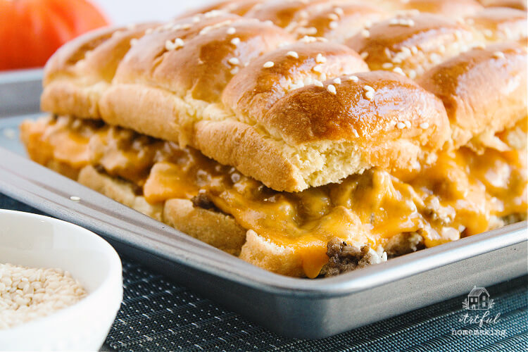 baking sheet full of baked cheeseburger sliders
