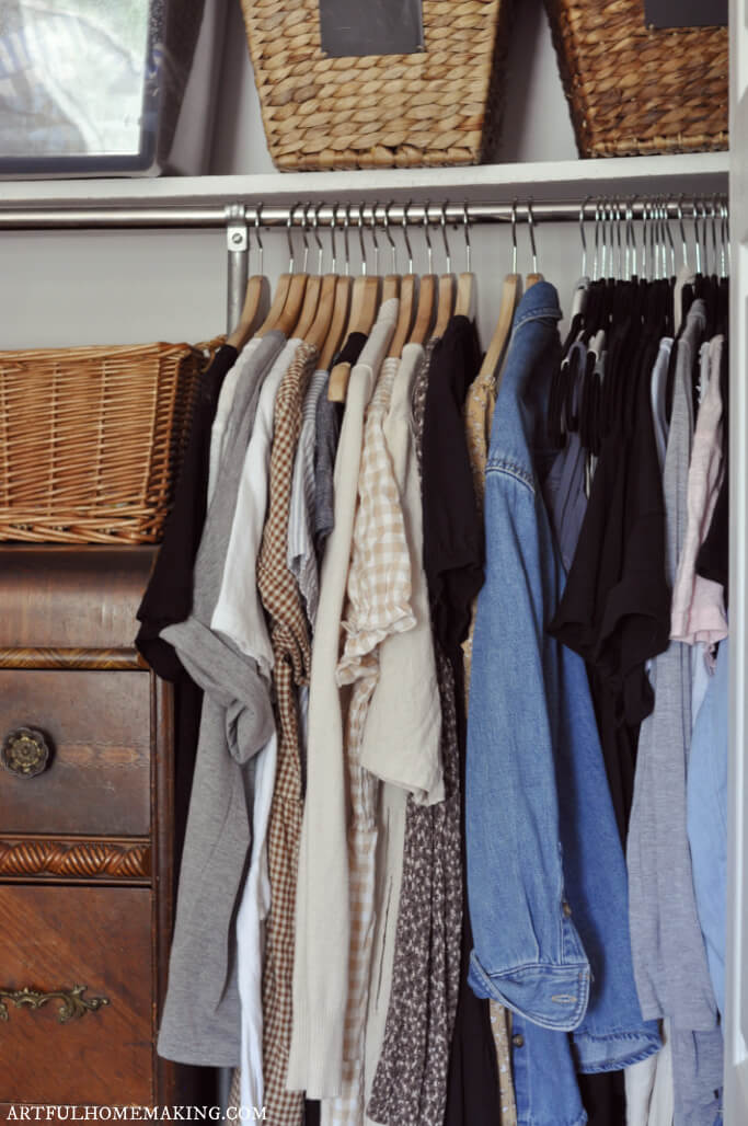 small closet with dresser inside