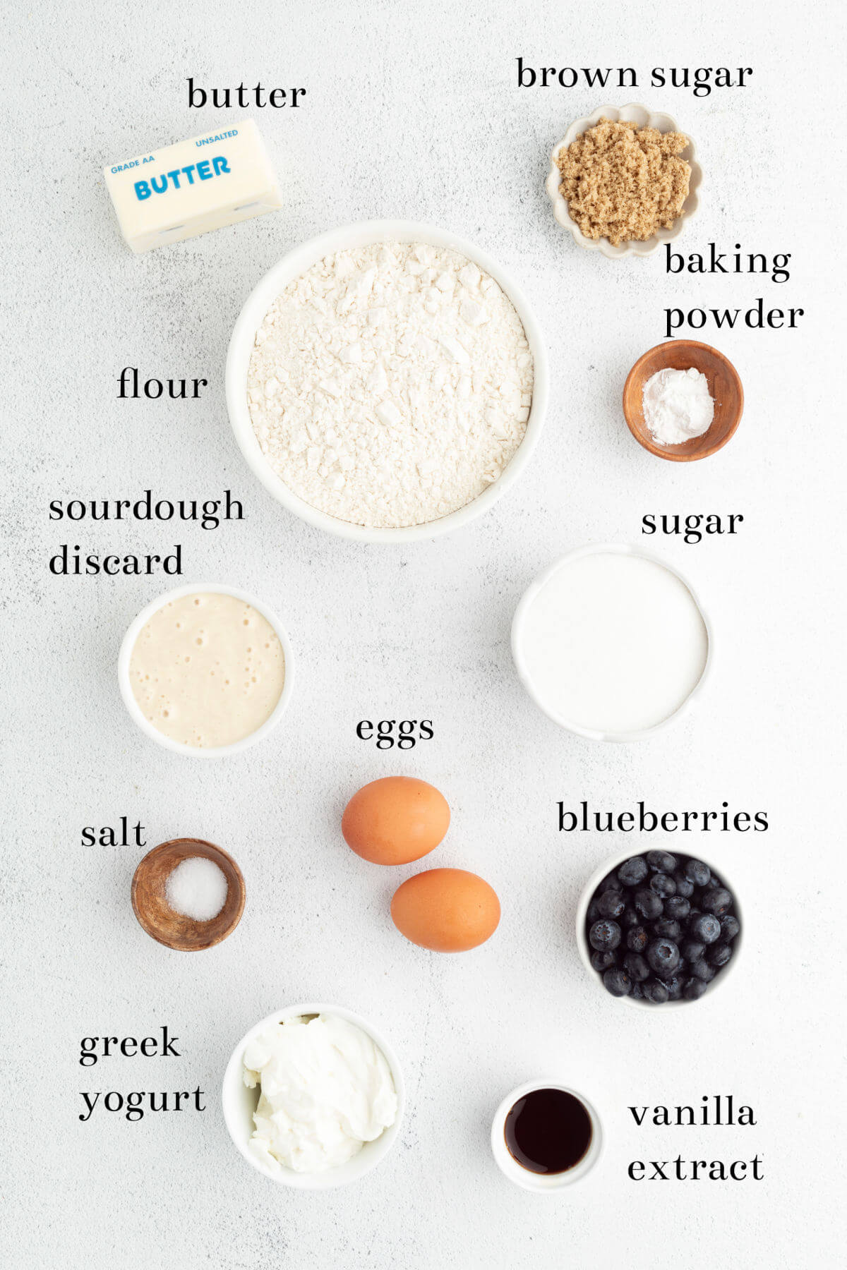 Ingredients in small bowls with text overlay labeling each ingredient.