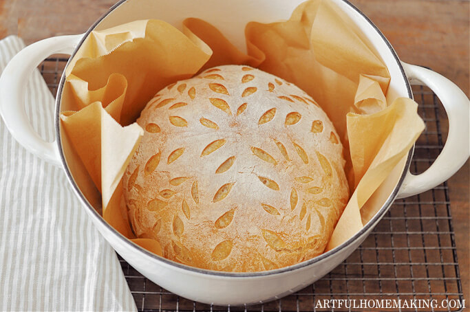 finished and baked loaf of sourdough bread in Dutch oven