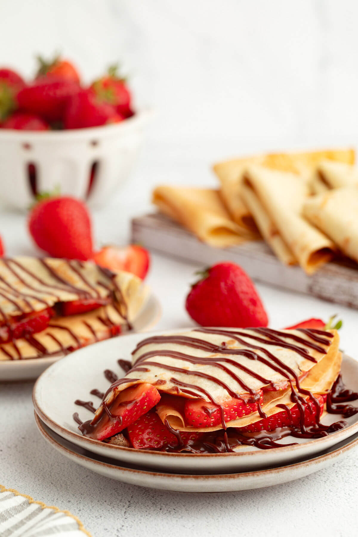 Sourdough crepes with strawberries and chocolate sauce.