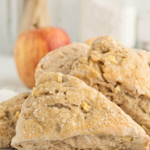 sourdough apple cinnamon scones on a wooden board.