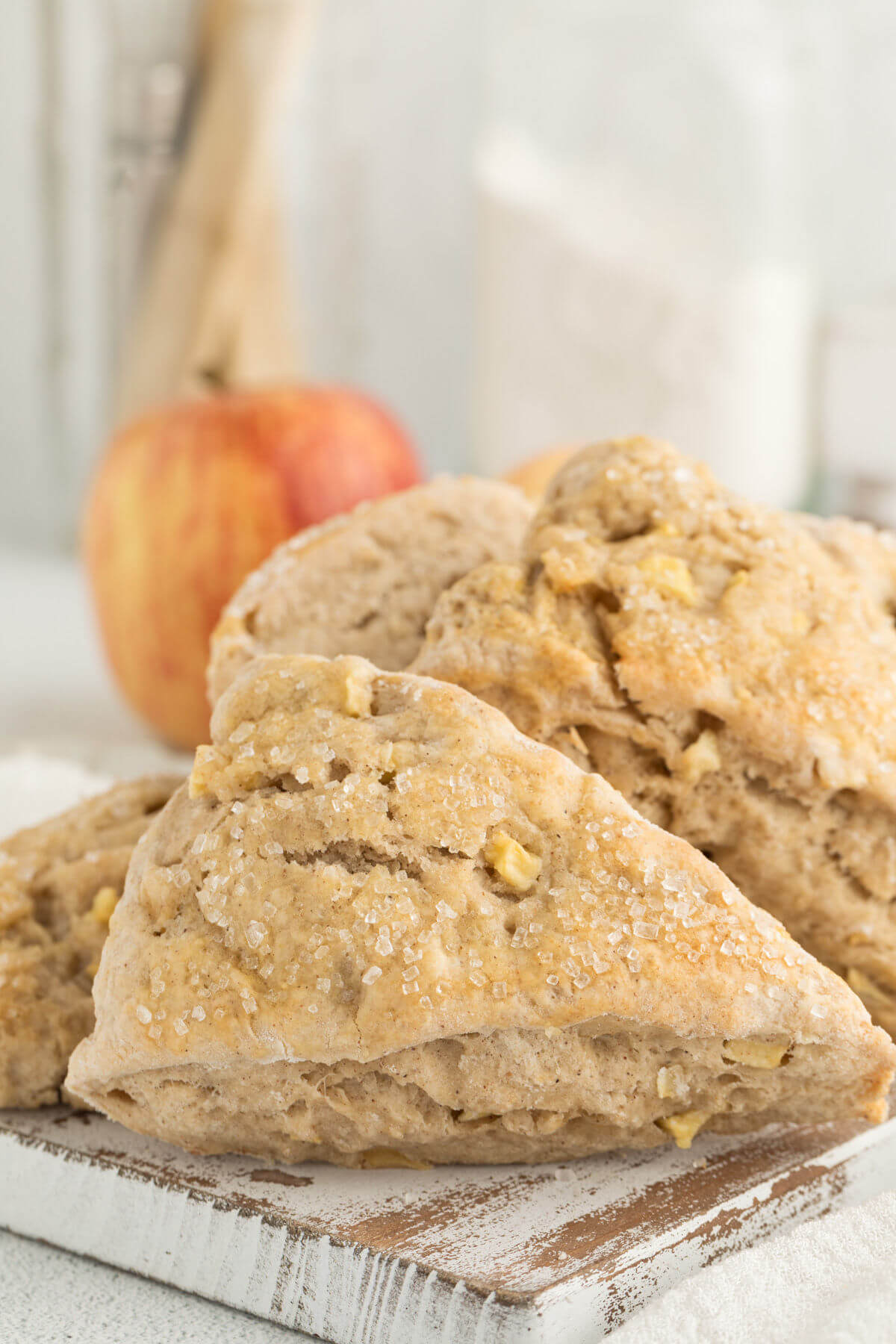 sourdough apple cinnamon scones on a wooden board.