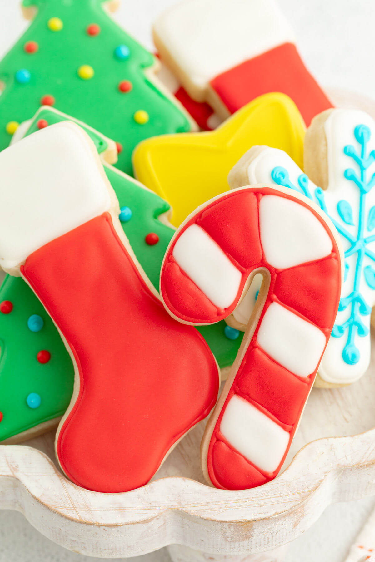 Sourdough cut out cookies with royal icing on a serving tray.