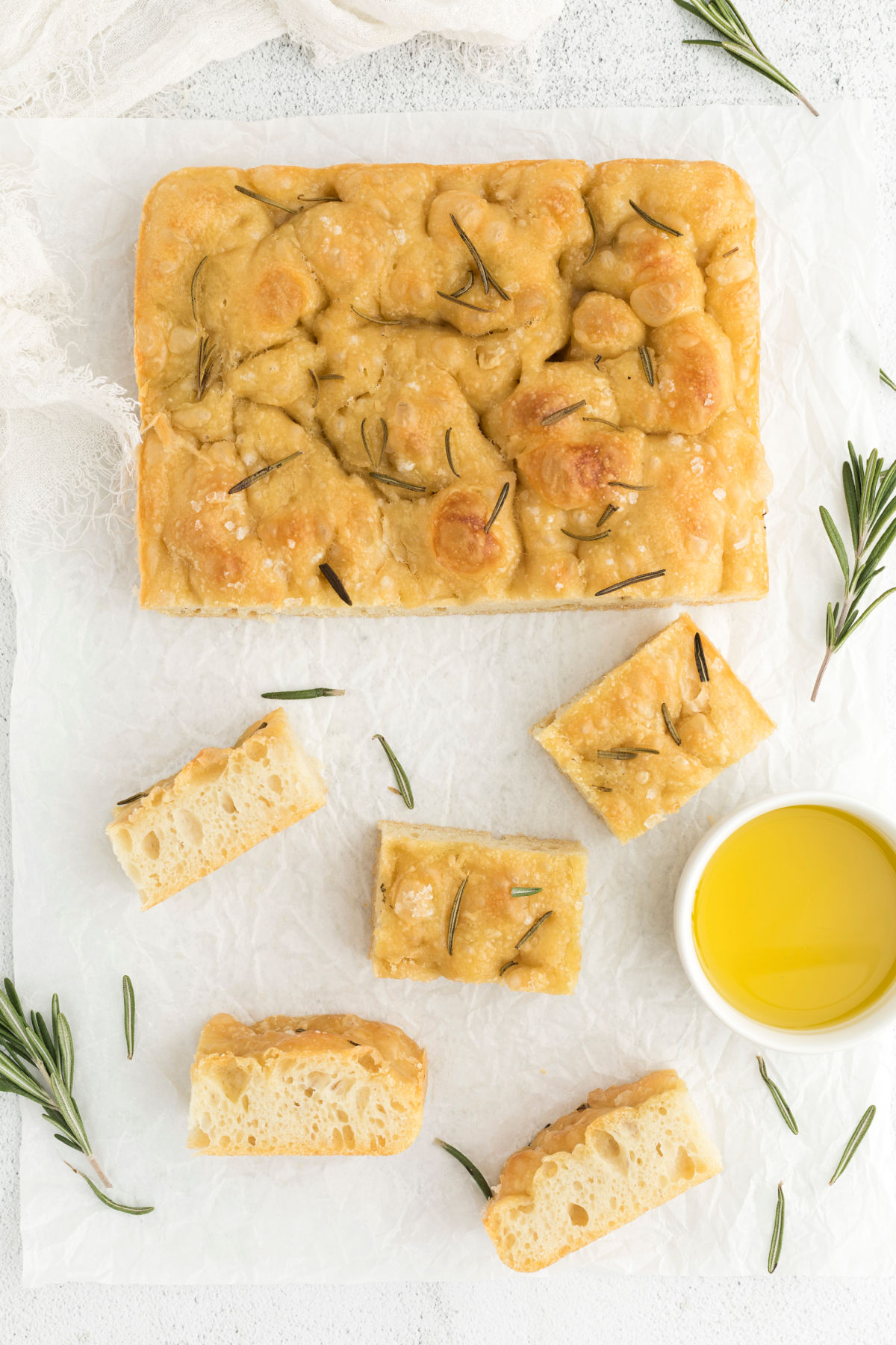 top view of sourdough focaccia on parchment paper