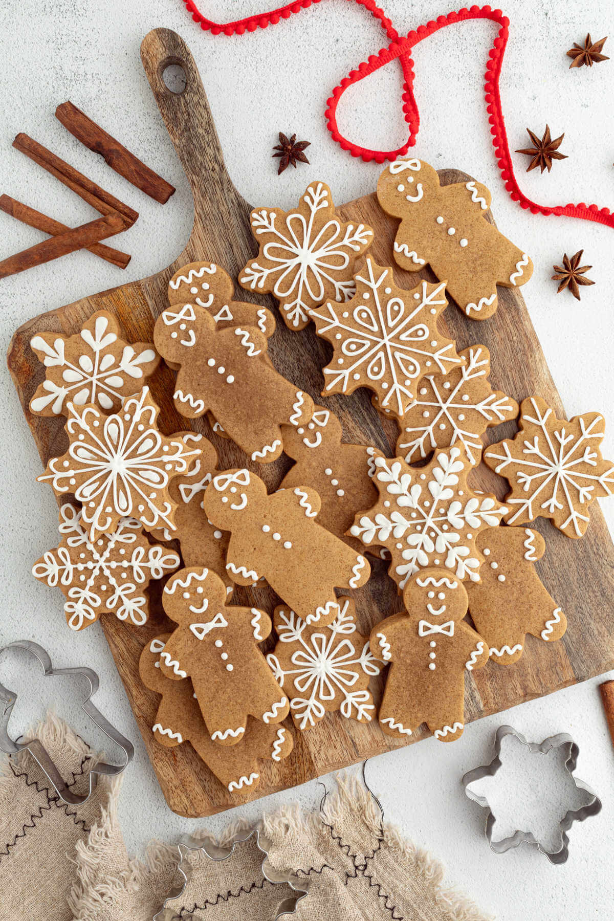 Sourdough gingerbread cookies on a wooden board.