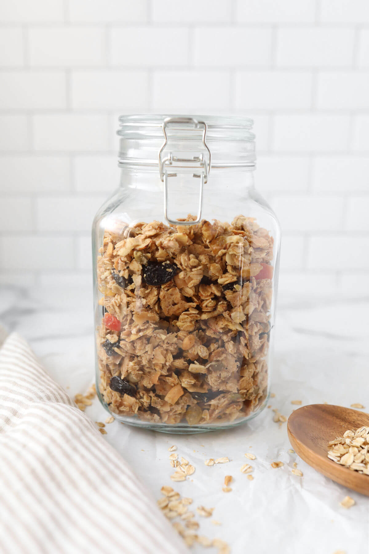 Sourdough granola in a glass jar with a clamp lid.