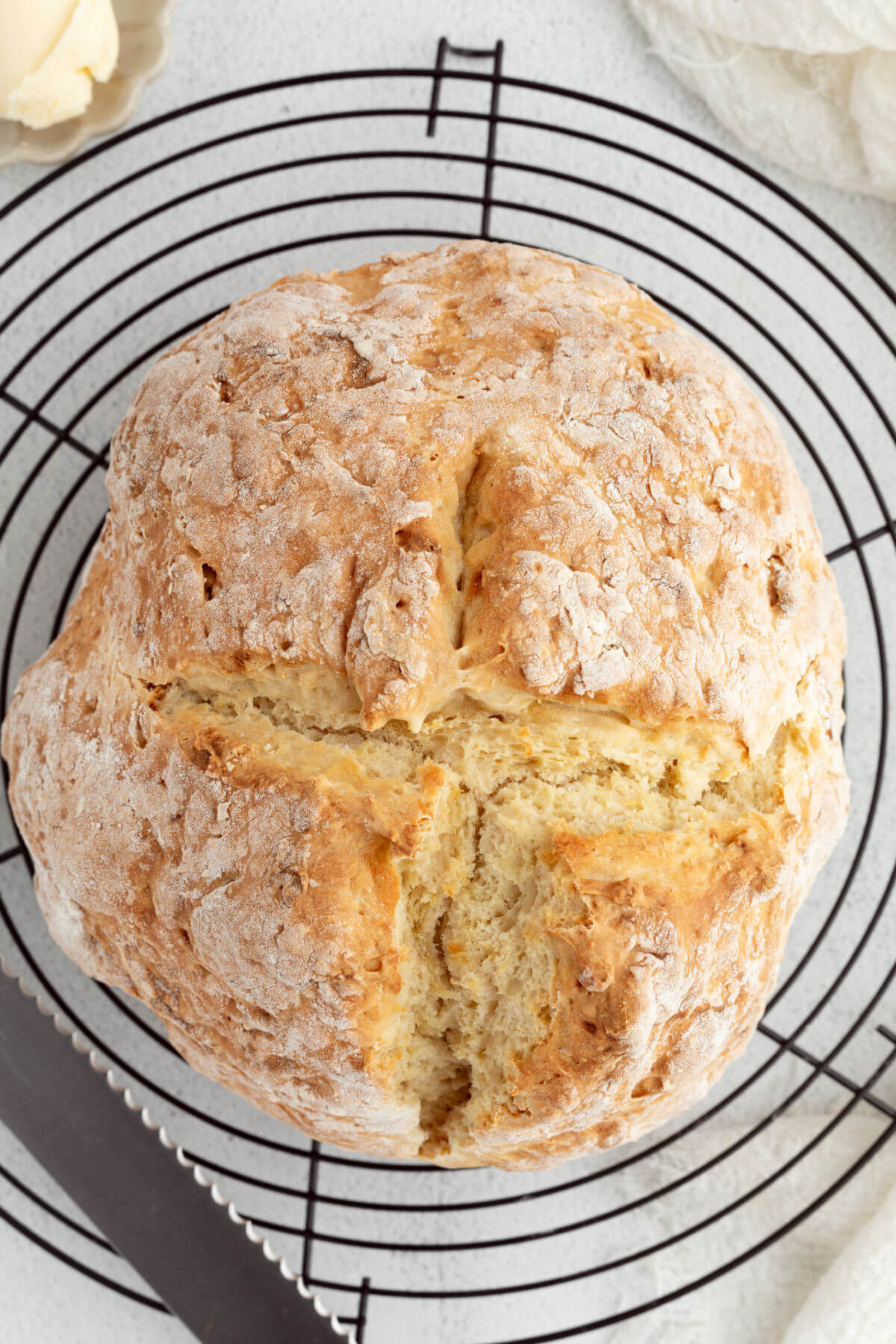 Sourdough Irish soda bread after baking, cooling on a wire cooling rack.