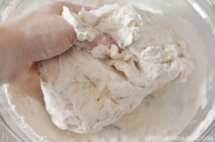 photo shows a hand mixing ingredients together with fingers