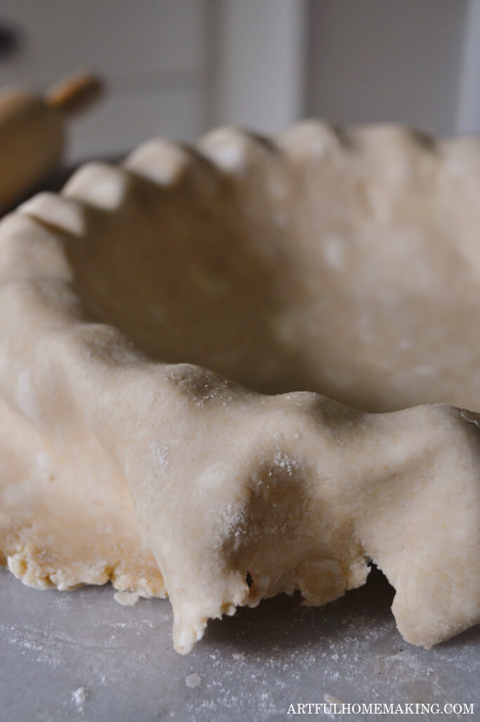 sourdough pie crust in pie dish on kitchen counter