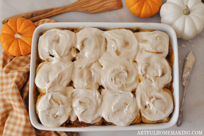 sourdough pumpkin cinnamon rolls in a casserole dish.