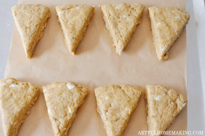 eight dough wedges on parchment paper on baking sheet