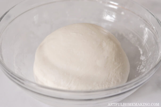dough rising in bowl for bulk fermentation