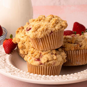 Sourdough strawberry muffins on a plate for serving.