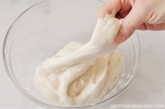 sourdough bread recipe photo showing stretching dough