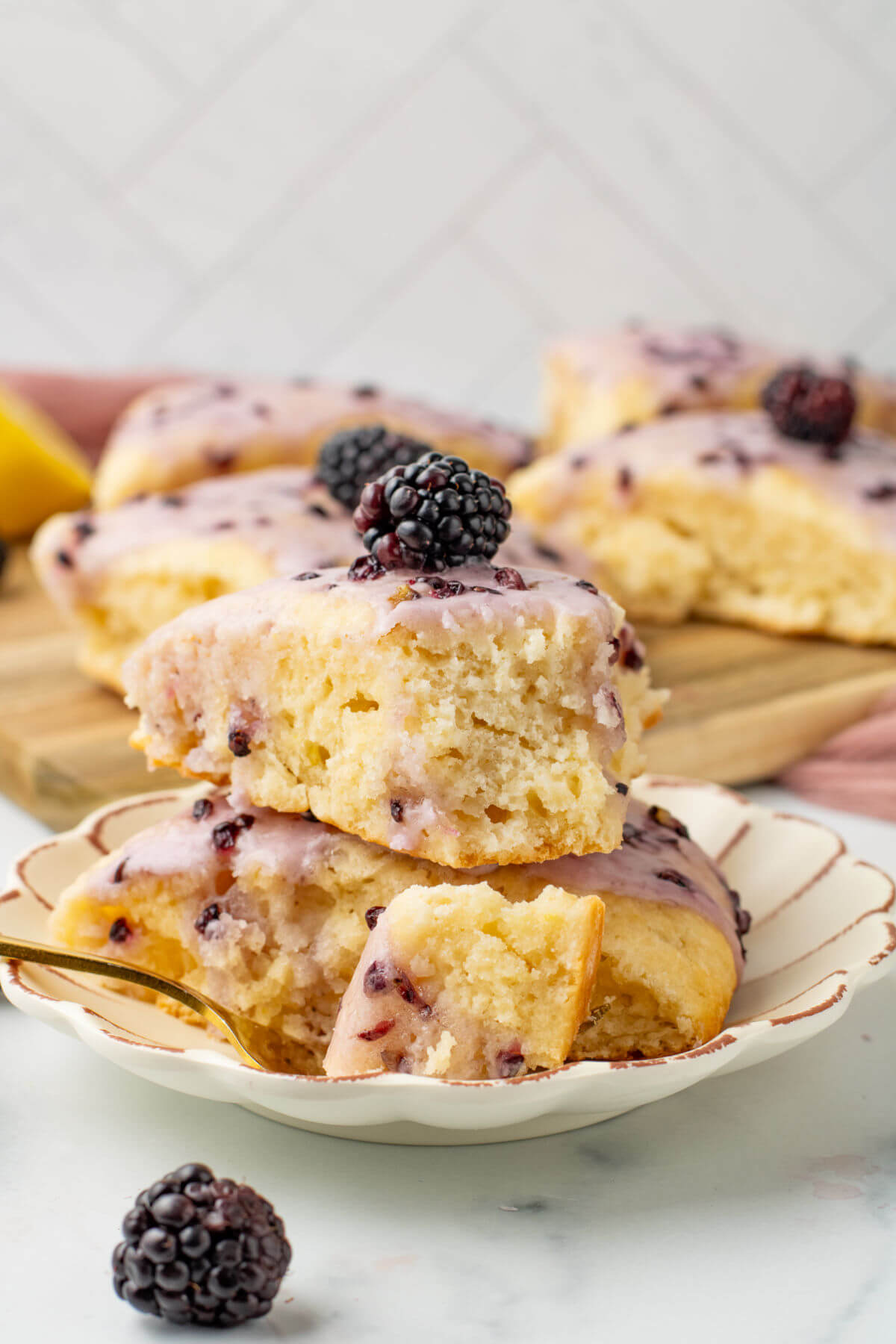 freshly baked lemon scones with blackberry glaze
