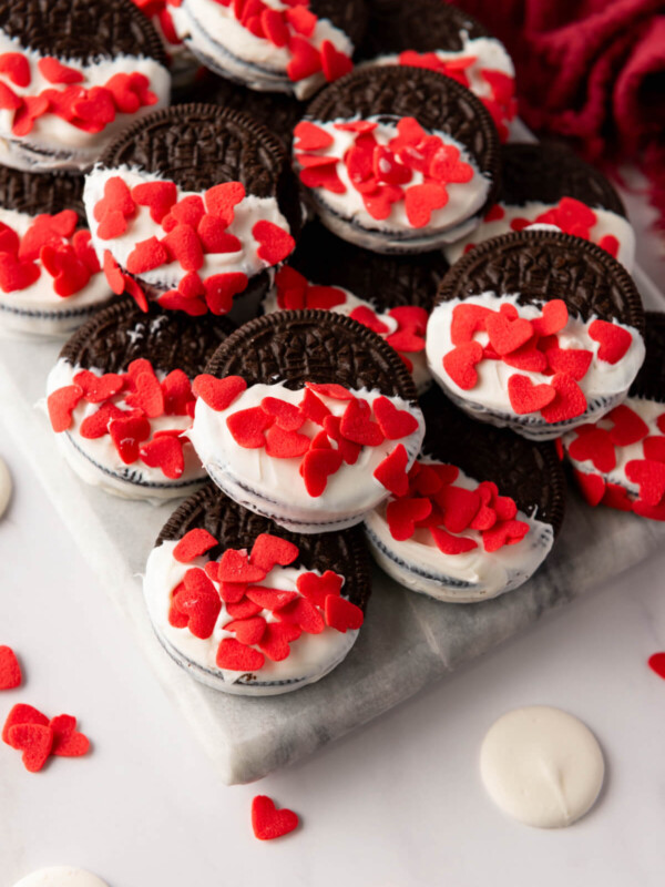 Valentine's Day Oreos dipped in white chocolate and coated with heart sprinkles