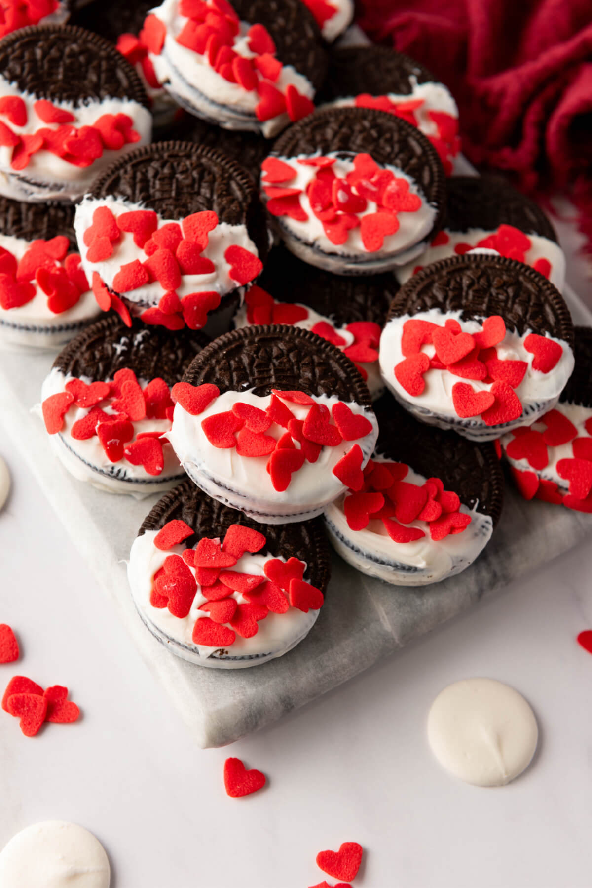Valentine's Day Oreos dipped in white chocolate and coated with heart sprinkles