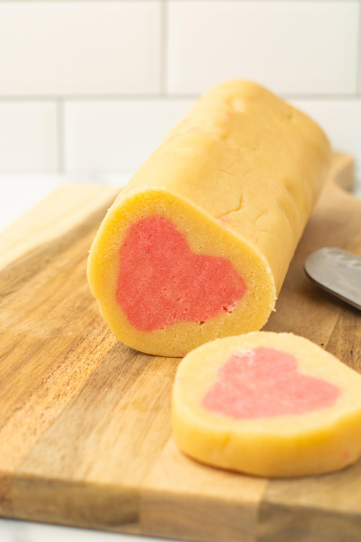 slice and bake heart cookies being sliced from the log of dough