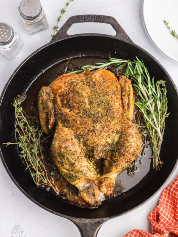 whole roasted chicken in a cast iron skillet