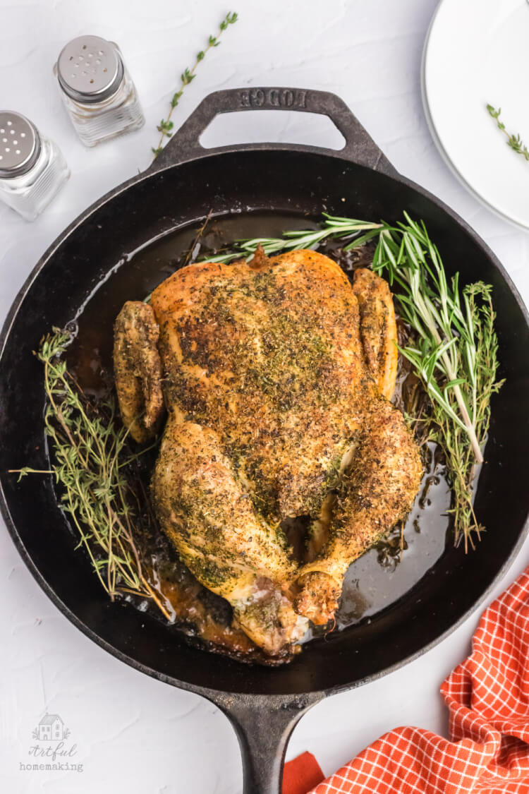 whole roasted chicken in a cast iron skillet