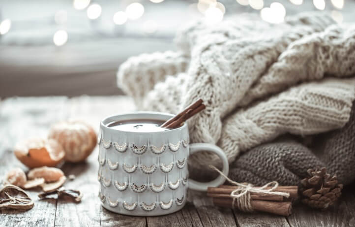 hot cocoa in a mug with sweaters